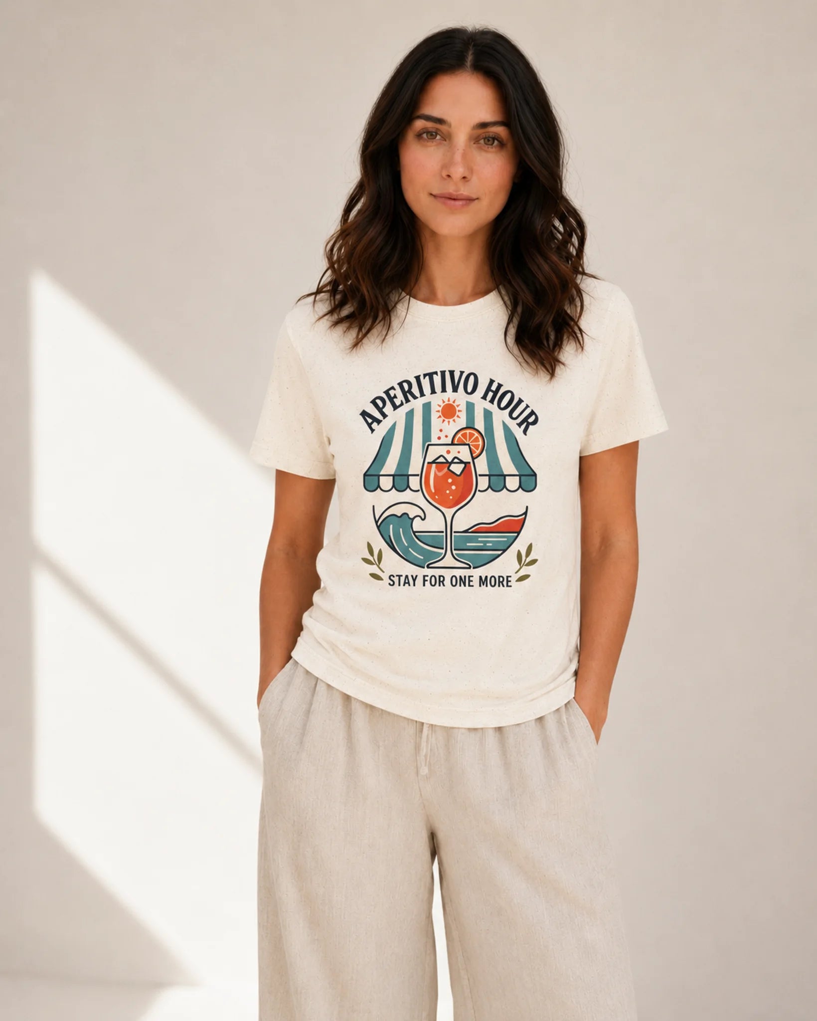 Woman wearing a white t-shirt with a graphic design and text on a plain background