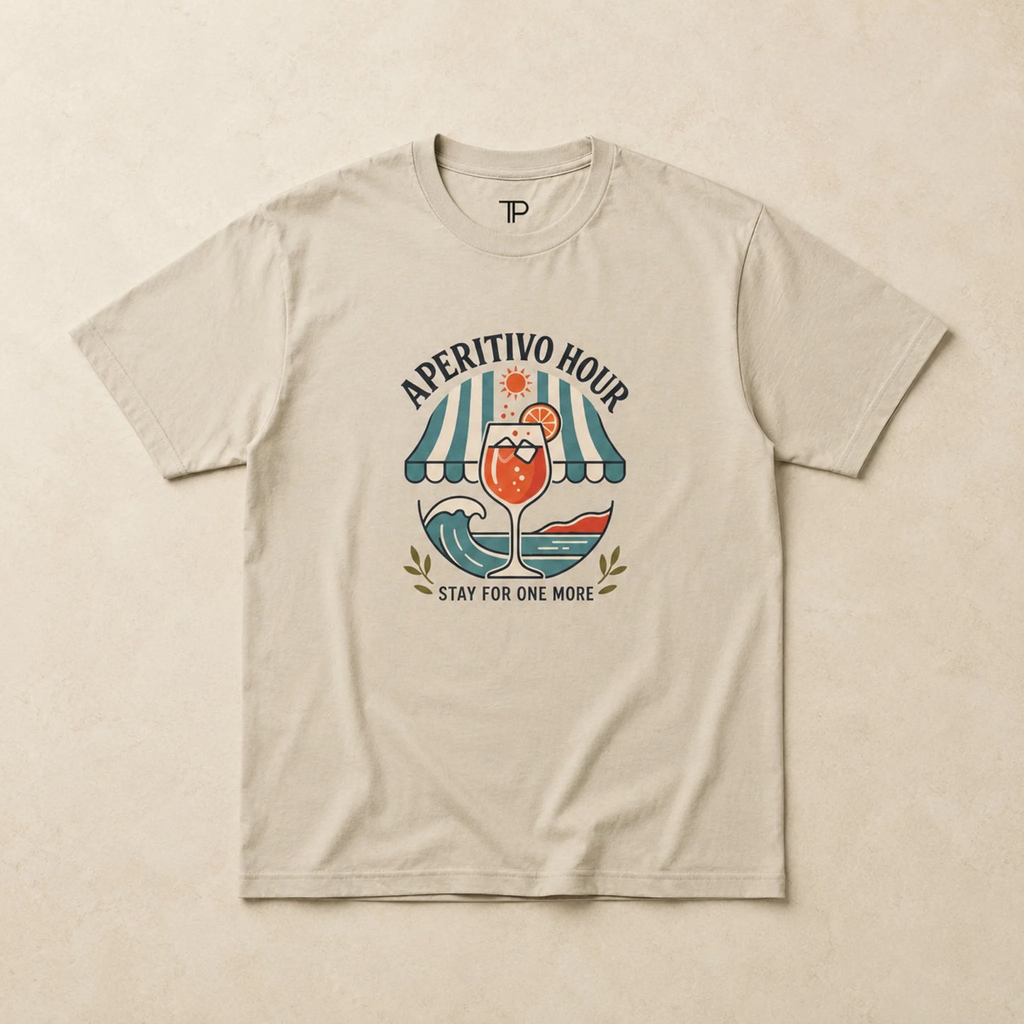 Beige t-shirt with 'Aperitivo Hour' graphic design on a beige background