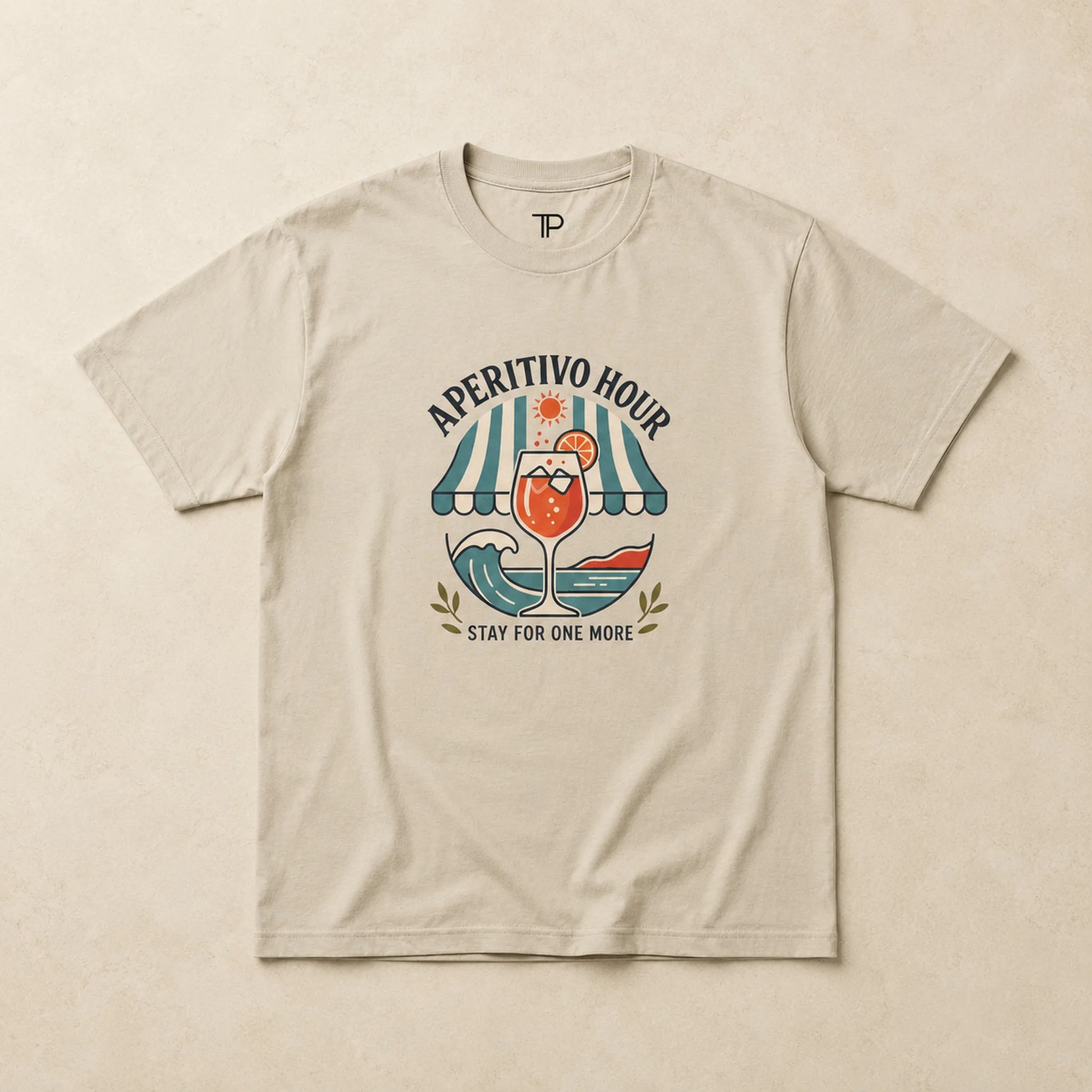 Beige t-shirt with 'Aperitivo Hour' graphic design on a beige background