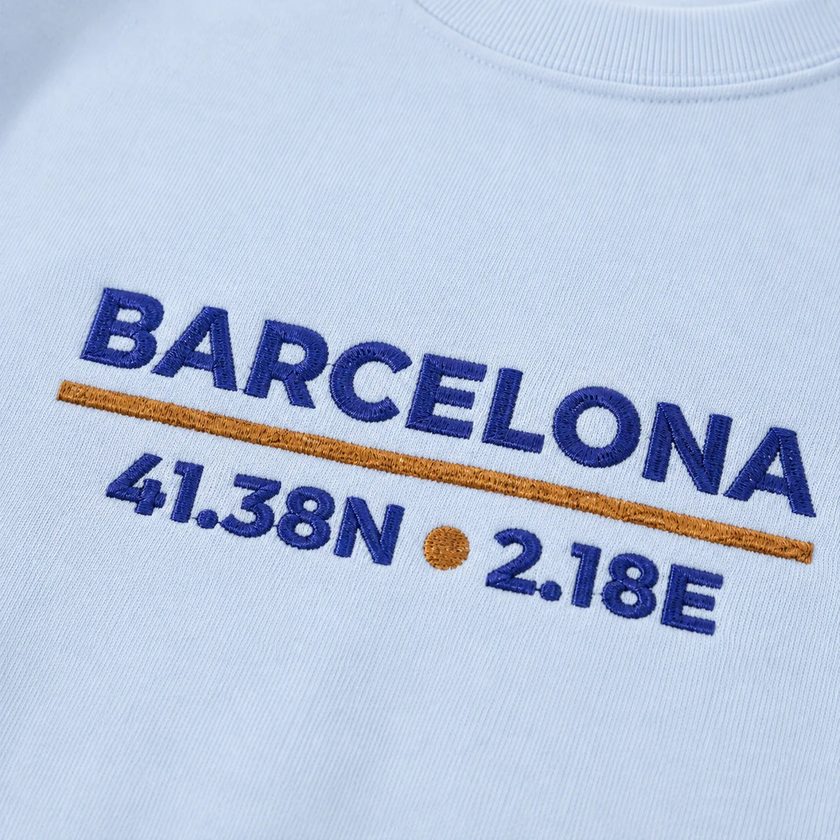Models wearing Barcelona Coordinates Embroidered Sweatshirt colorways, showing the embroidered front design.