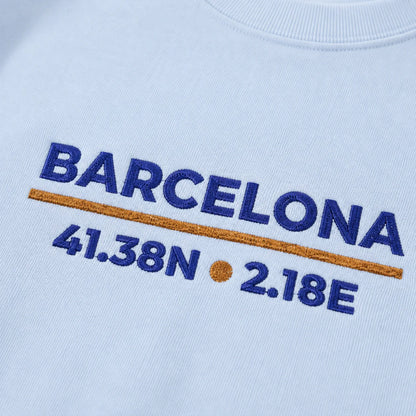 Models wearing Barcelona Coordinates Embroidered Sweatshirt colorways, showing the embroidered front design.