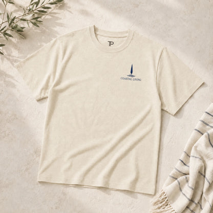 Flat lay of  Beige t-shirt with 'Coastal Living' design