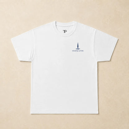 Flat lay of a white t-shirt with 'Coastal Living' design