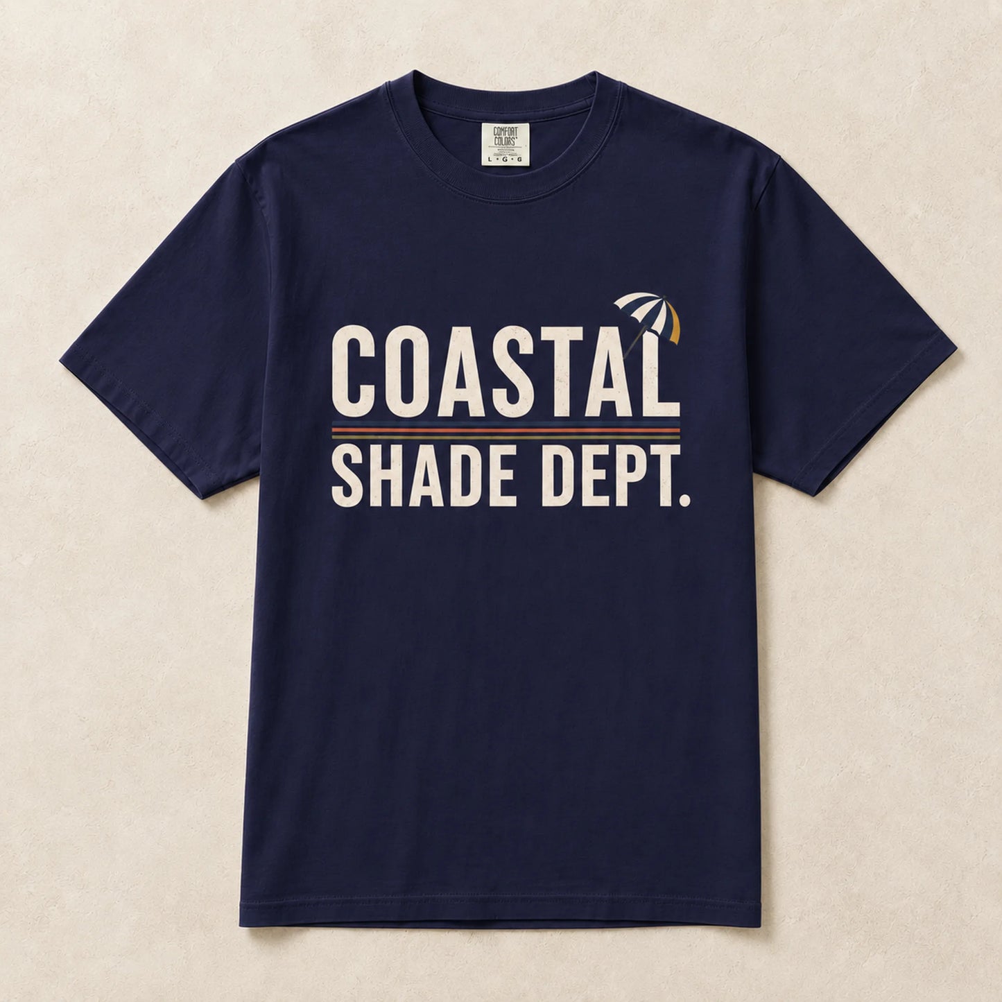 Navy Coastal Shade Dept graphic T-shirt laid flat with vintage beach-inspired print