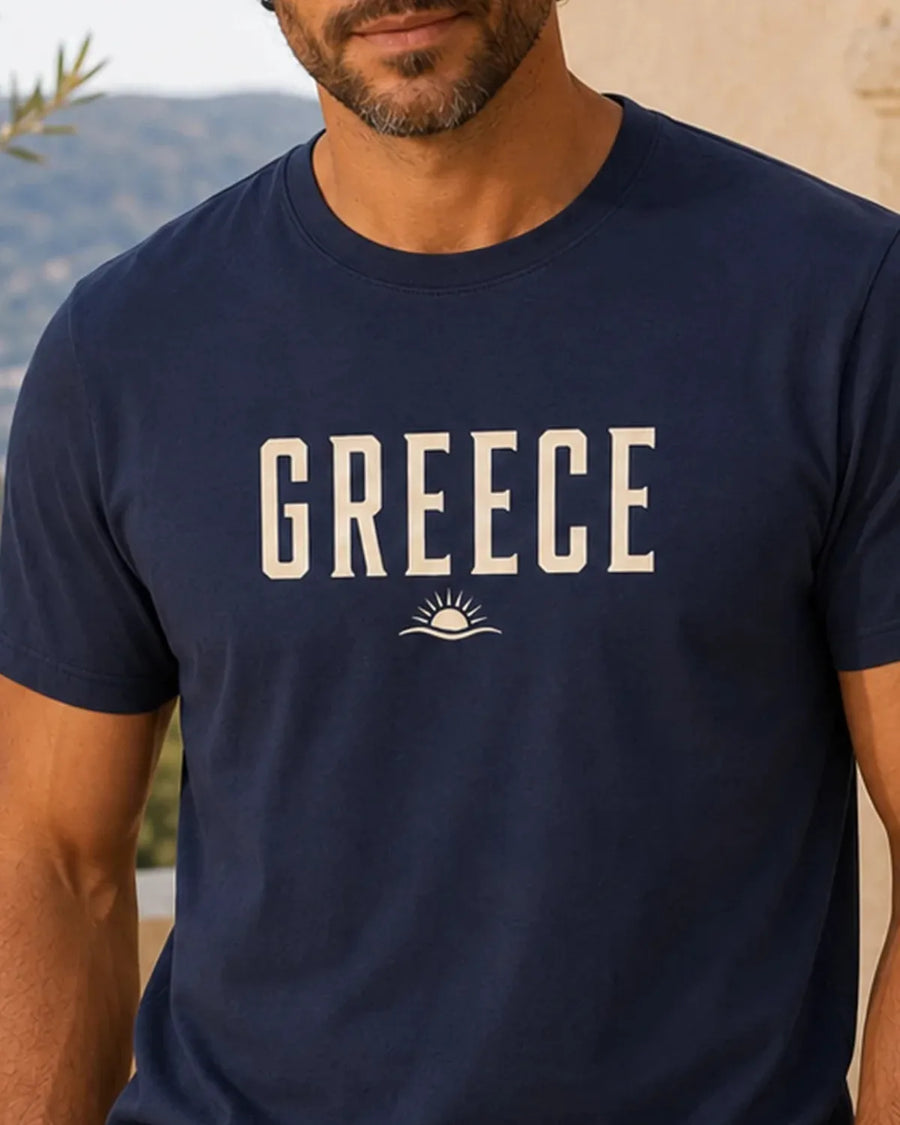 Navy GREECE Essential T-shirt with warm cream wordmark and sun-and-wave front print