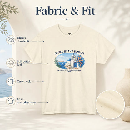 An off-white short-sleeve crewneck t-shirt with a blue and green graphic of a Greek island summer scene. The image is a marketing graphic labeled 'Fabric & Fit' with callouts describing the unisex classic fit, soft cotton feel, crew neck, and easy everyday wear, plus a circular fabric texture inset.