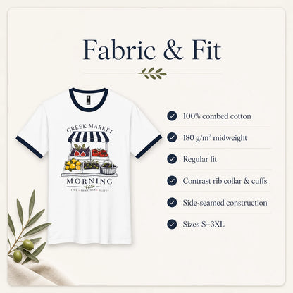 A white ringer T-shirt with navy blue trim and a colorful Greek market morning stand graphic on the front, shown on a cream background with text reading 'Fabric & Fit' and a list of fabric and fit details.