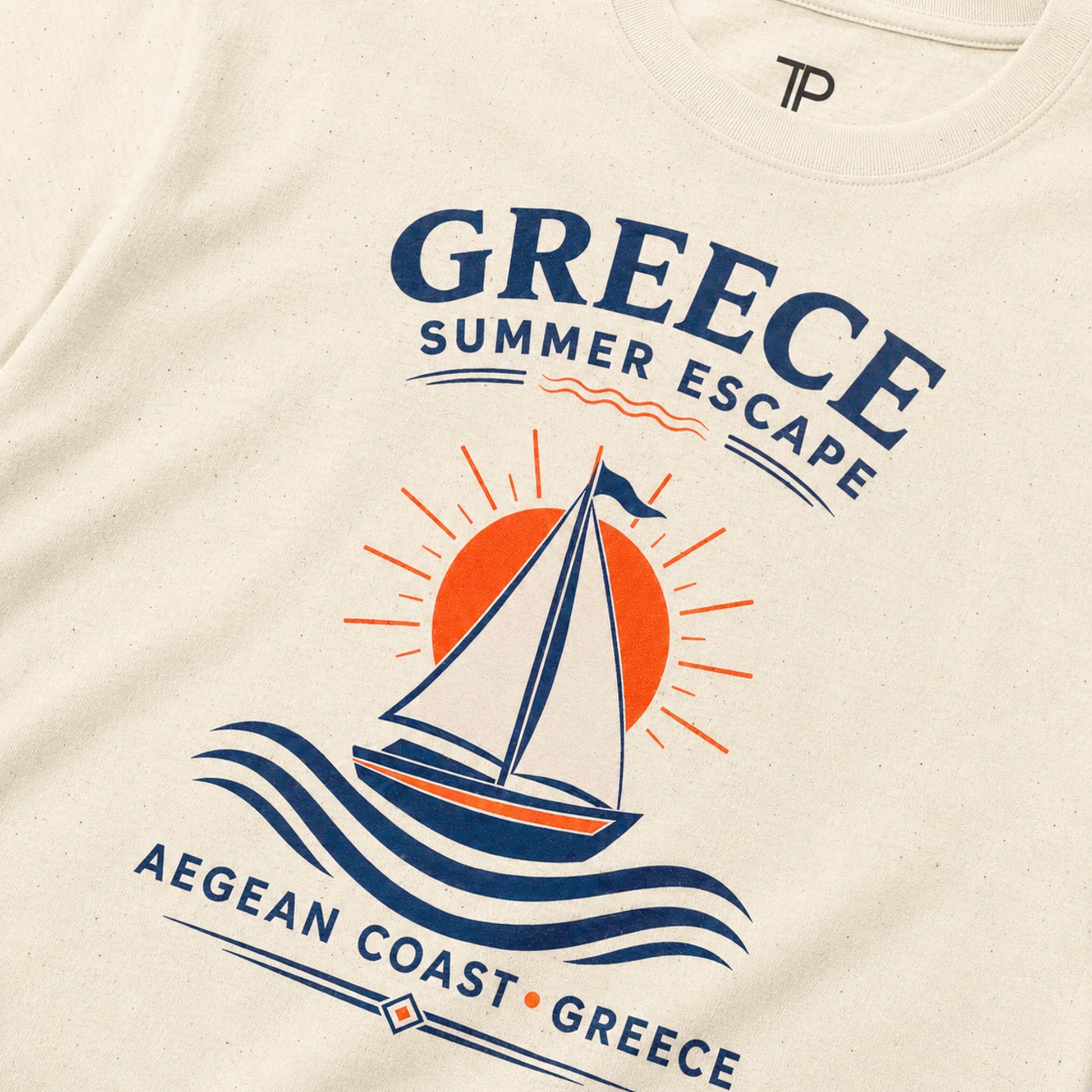 Beige t-shirt with a sailboat graphic and 'Greece Summer Escape' text on a white background