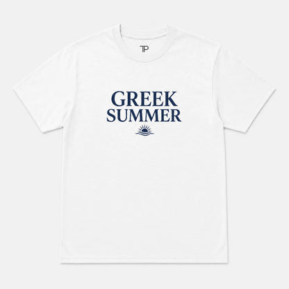 A white short-sleeve crewneck t-shirt with 'GREEK SUMMER' printed in navy blue on the chest, accompanied by a small sun and wave graphic below. A small 'TP' logo is visible inside the collar.