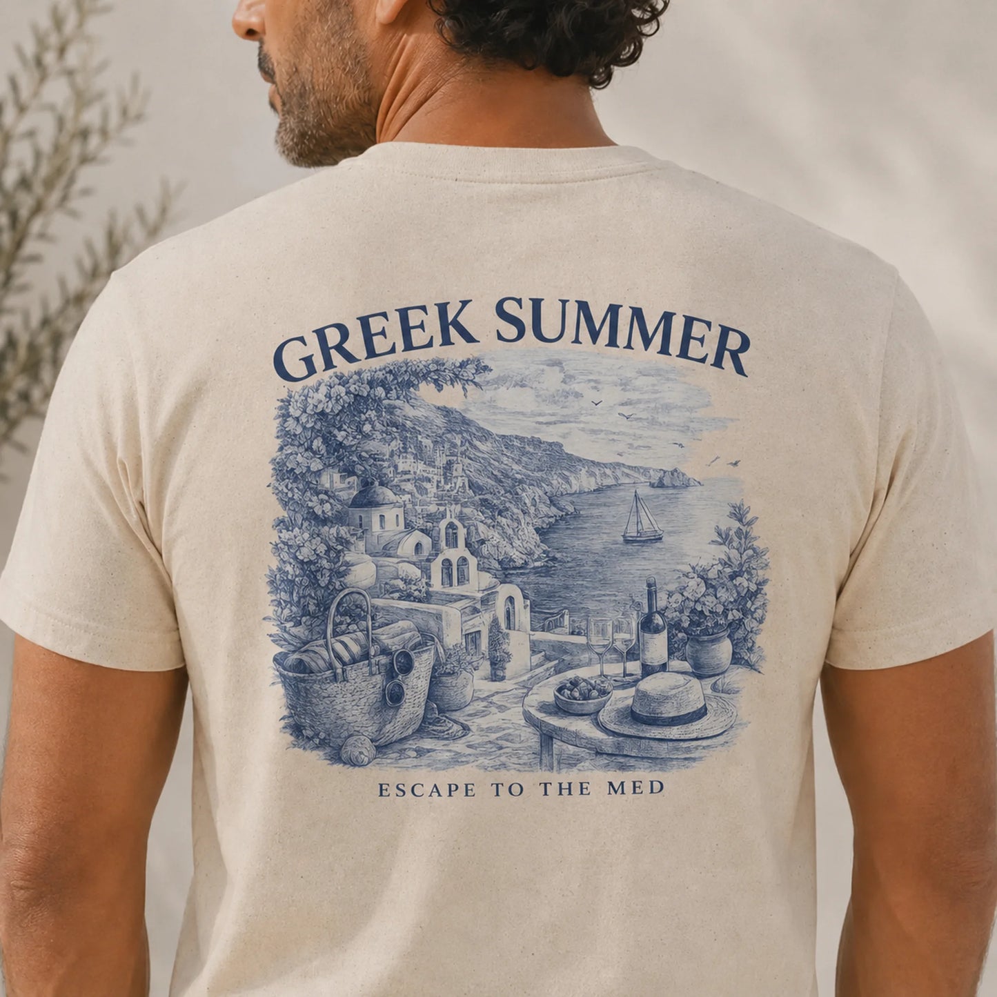 TP HERO: Man wearing a t-shirt with 'Greek Summer' design and text.