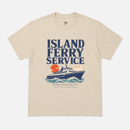 A beige crewneck t-shirt featuring a retro-style graphic print of an 'Island Ferry Service' cruise ship with a sunset and Mediterranean Deck Pass text, displayed flat against a light gray background.