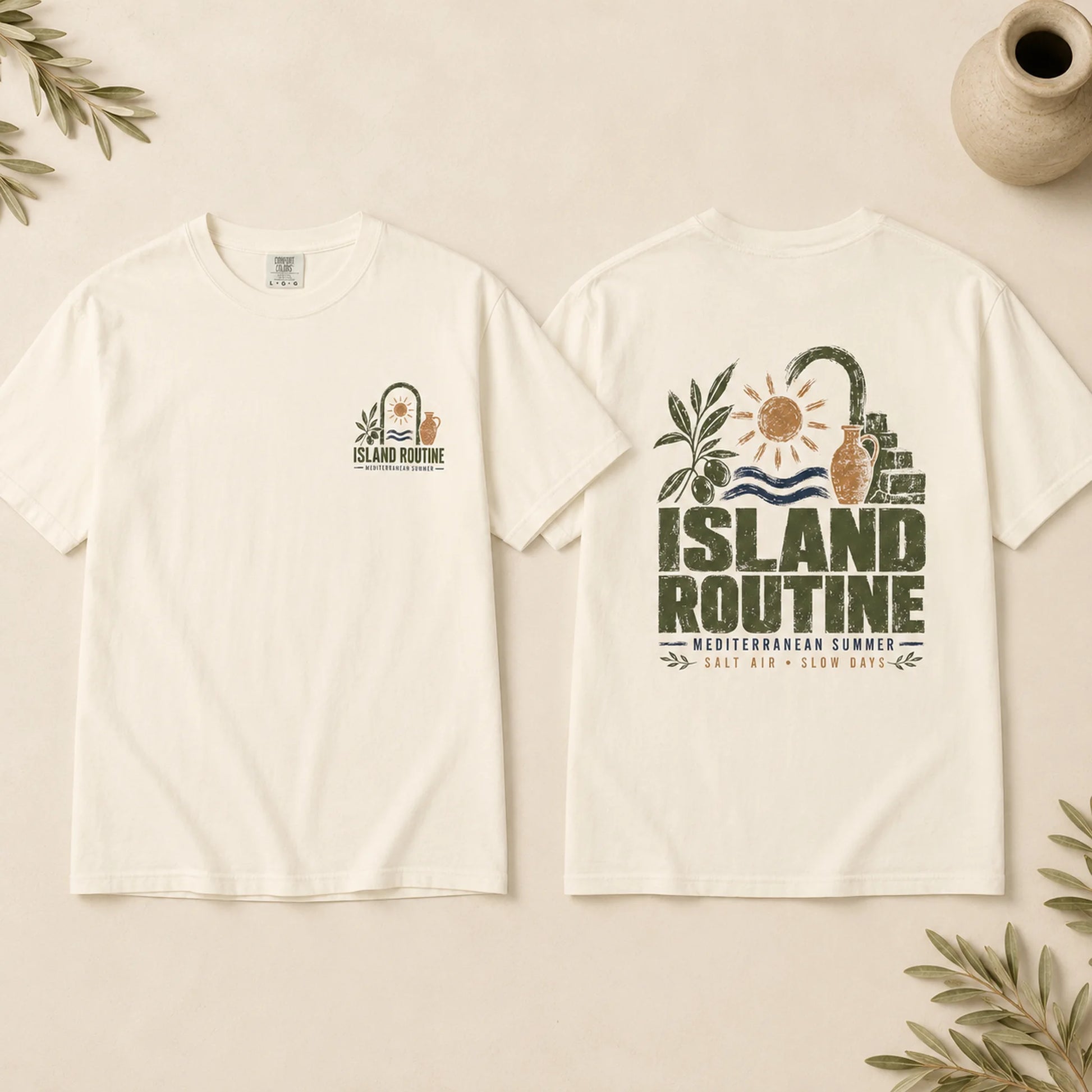 White t-shirt with 'Island Routine' design on a beige background