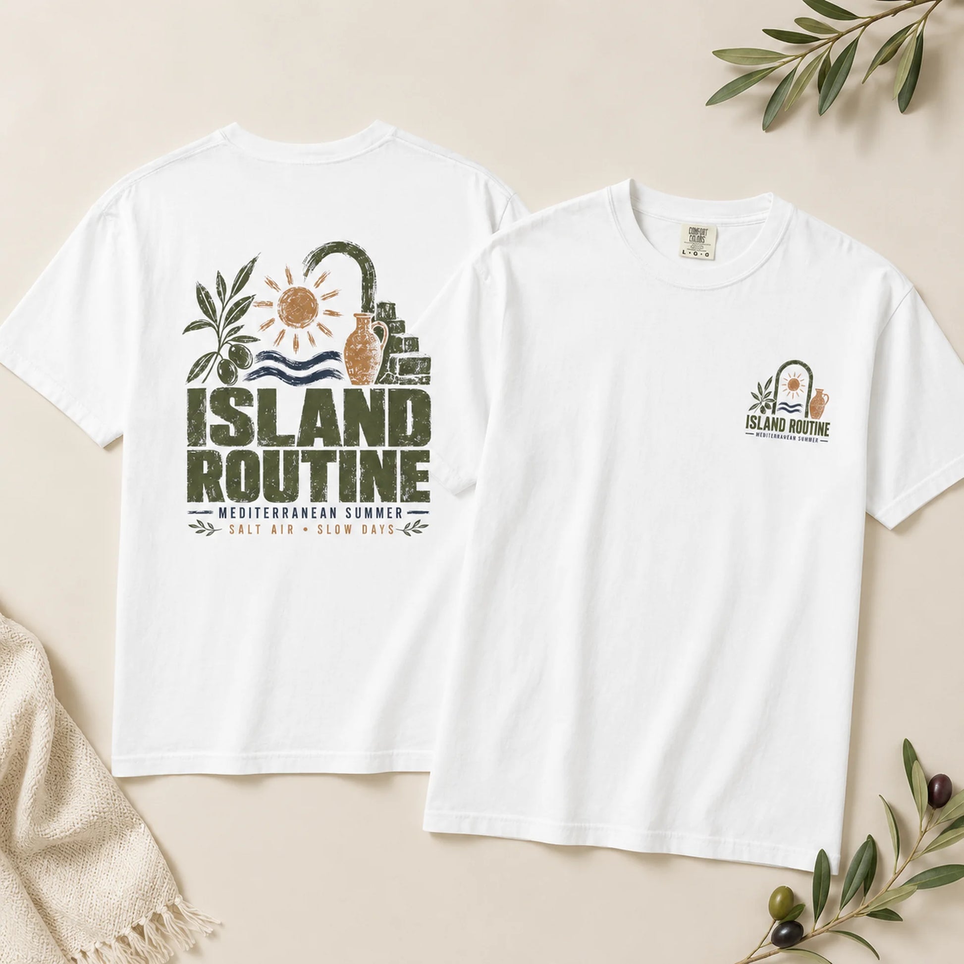 White t-shirt with 'Island Routine' design on a beige background