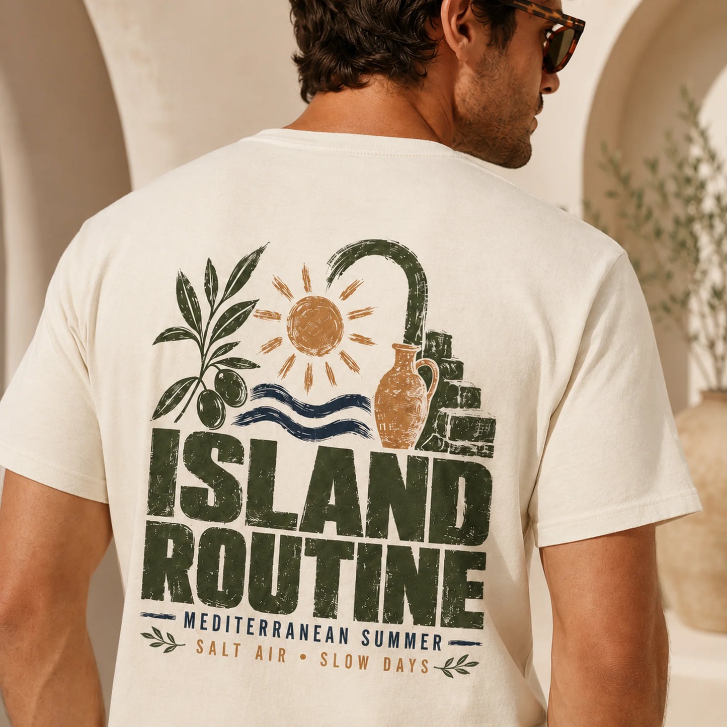TP HERO: Man wearing a t-shirt with 'Island Routine' design outdoors