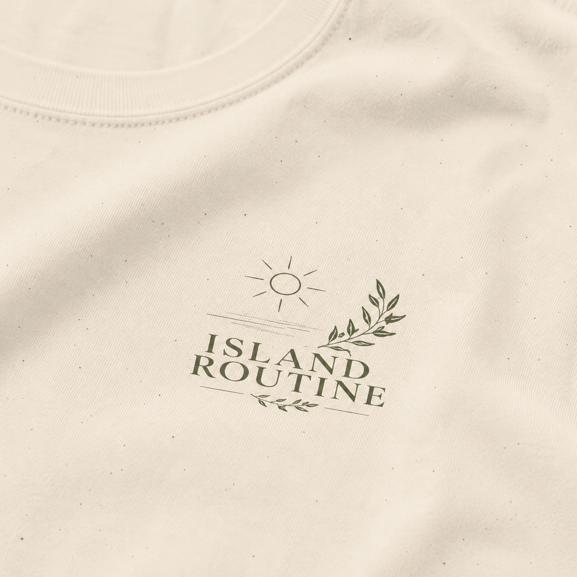 Beige fabric with 'Island Routine' logo printed on it