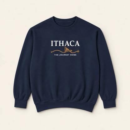 A navy blue crewneck sweatshirt with a graphic on the chest reading 'ITHACA' and 'THE JOURNEY HOME' in white, with a small brown illustration below, displayed on a light beige background.