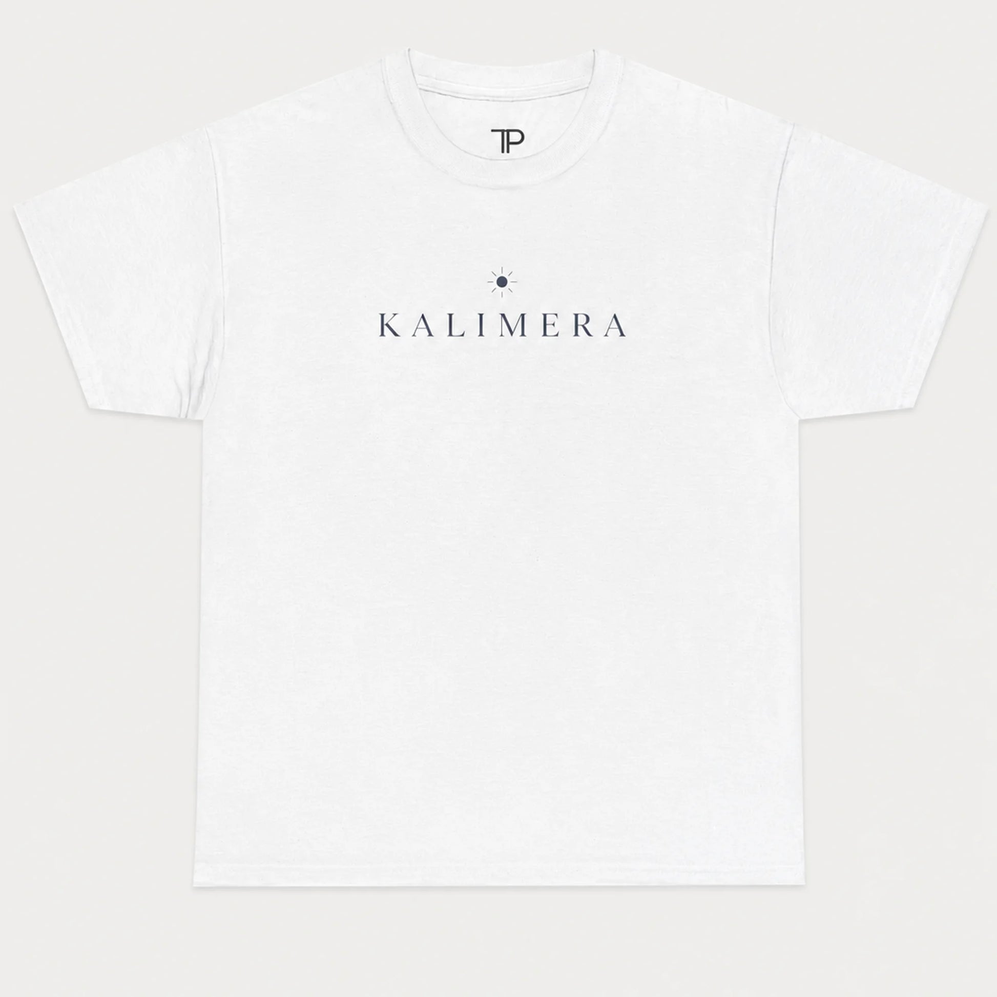 A white short-sleeve crewneck t-shirt with 'KALIMERA' printed in navy blue across the chest, flanked by a small navy star graphic, shown on a light gray background.