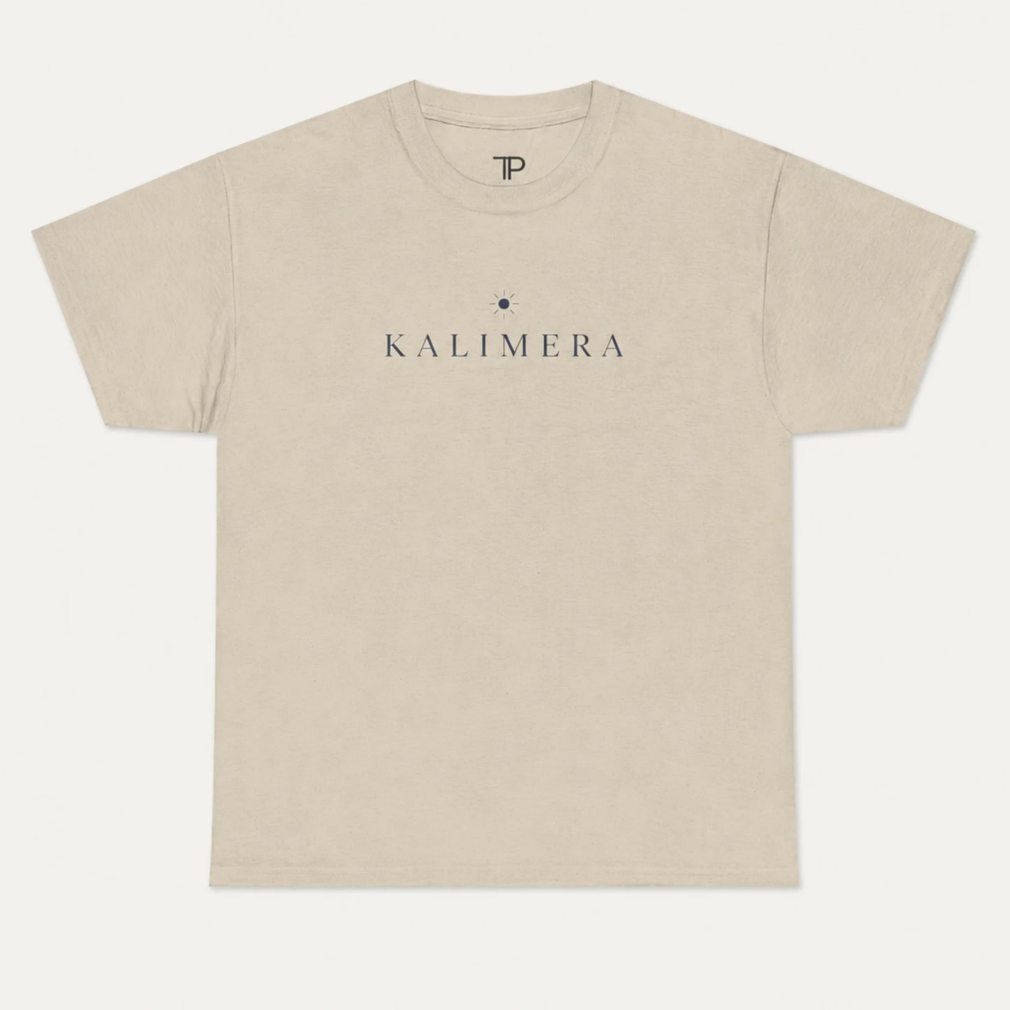 A sand crewneck t-shirt with 'KALIMERA' printed in dark gray across the chest, flanked by a small dark star logo, shown on a light gray background.