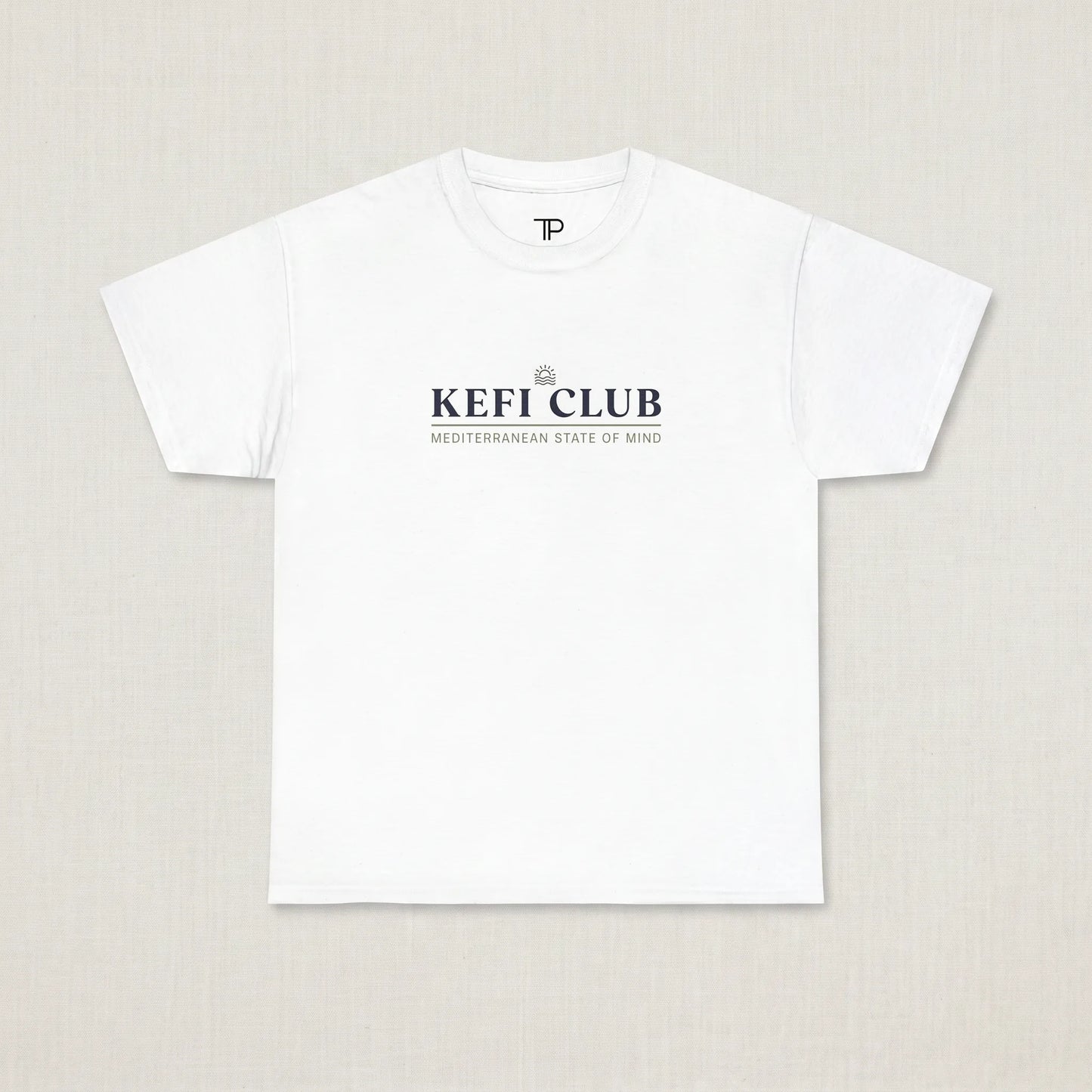 White t-shirt with 'KEFI CLUB' text on a beige background