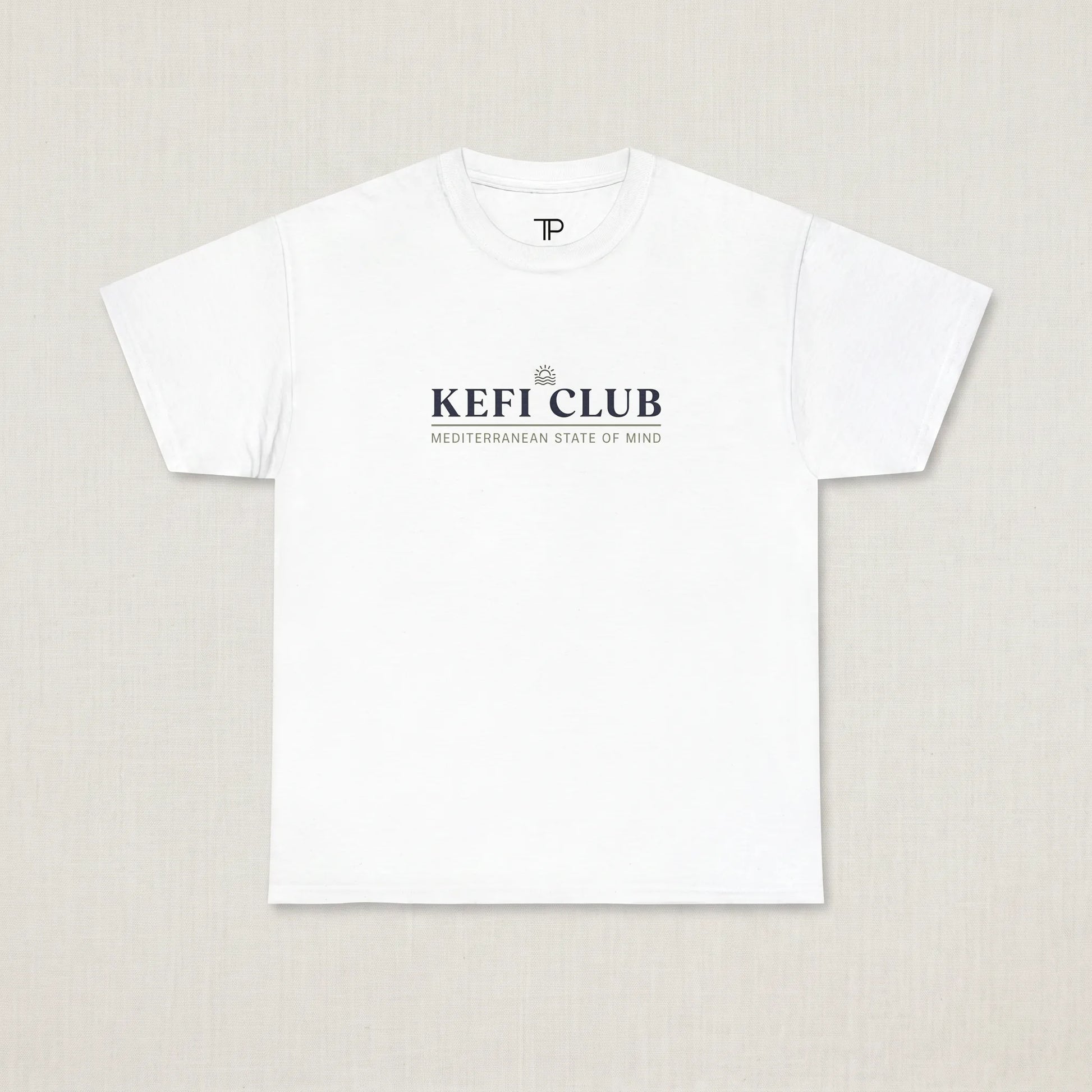 White t-shirt with 'KEFI CLUB' text on a beige background