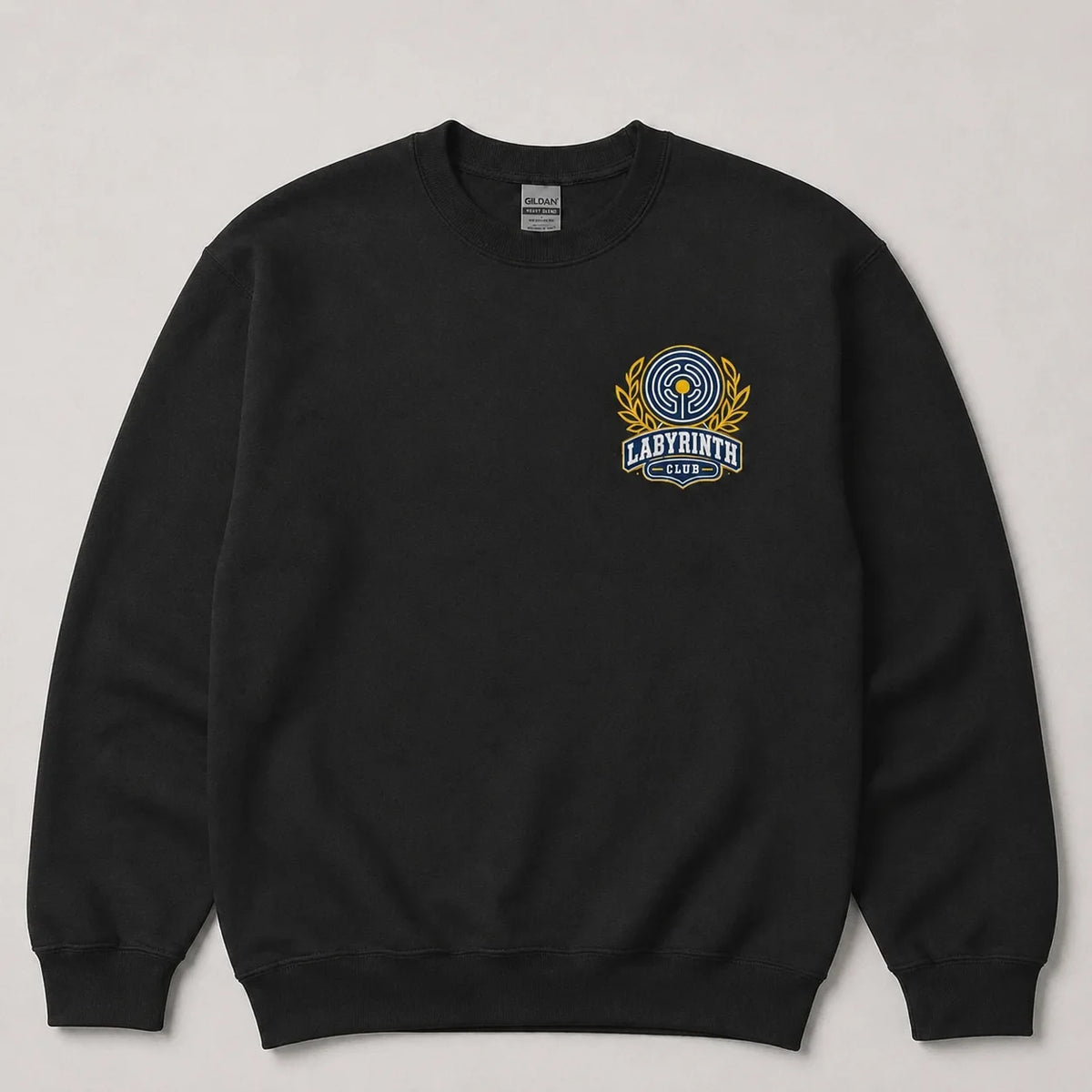A black crewneck sweatshirt with a colorful 'Labyrinth Club' graphic on the left chest, displayed flat against a light gray background.