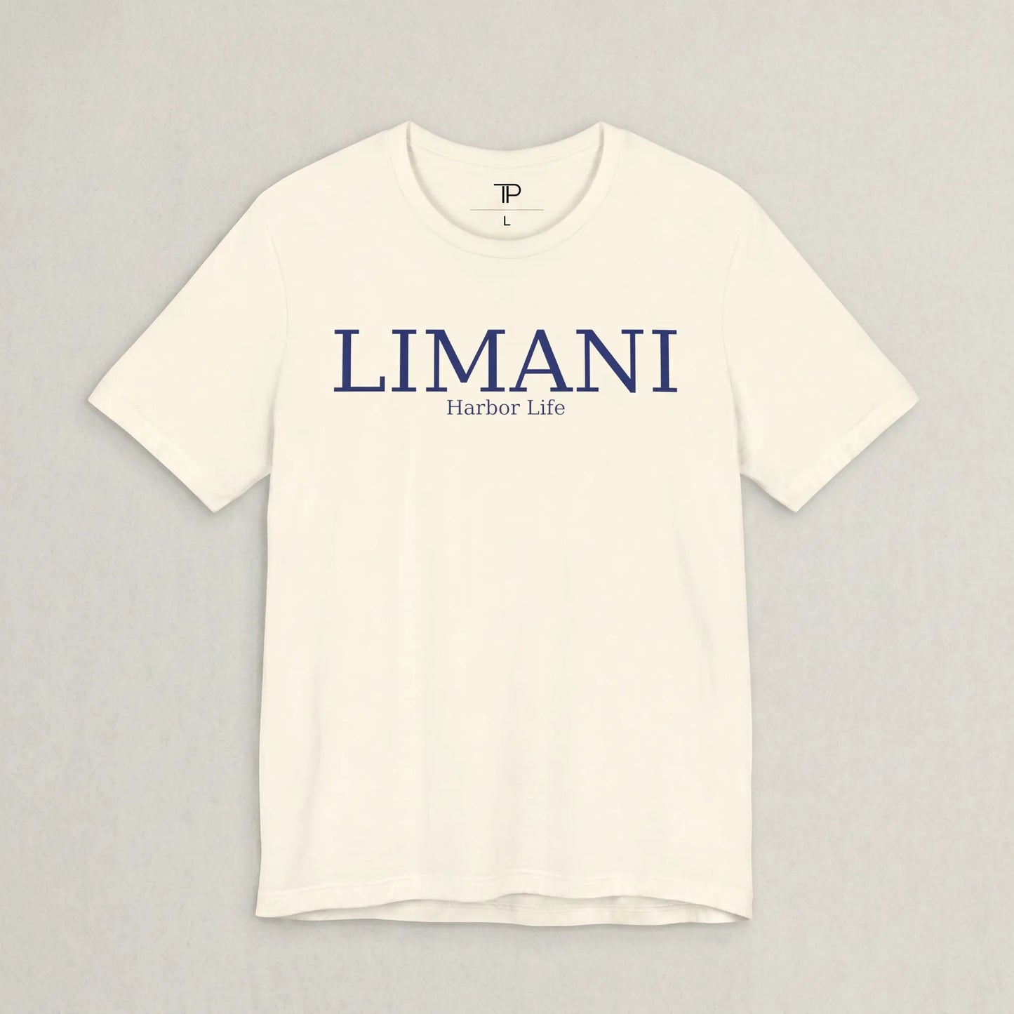 White t-shirt with 'LIMANI' and 'Harbor Life' text on a gray background