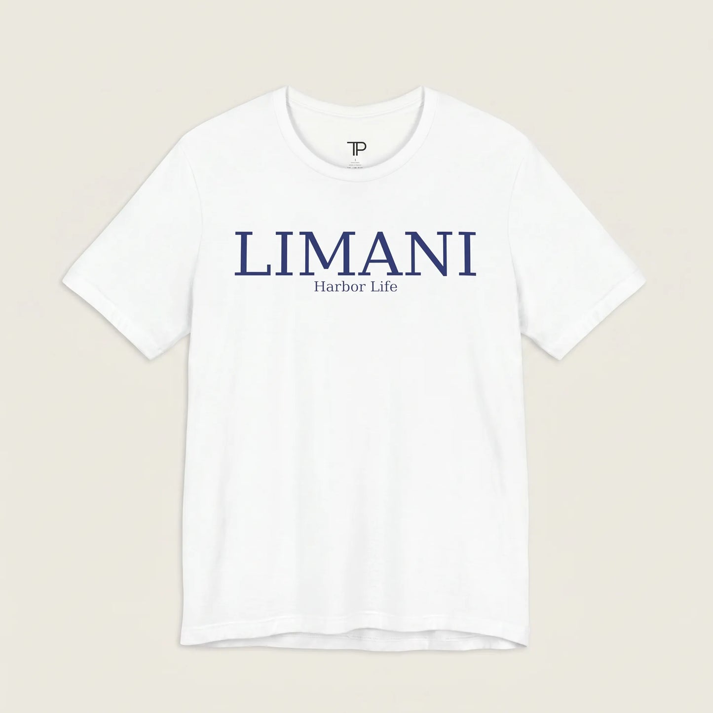 White t-shirt with 'LIMANI' and 'Harbor Life' text on a beige background
