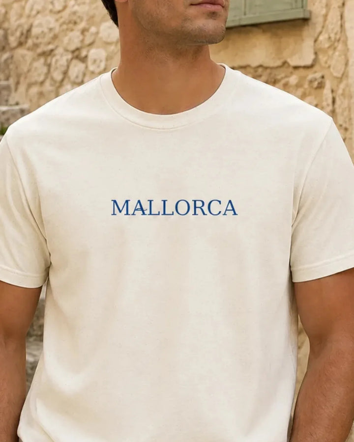 Natural Mallorca Essential T-shirt with minimal blue MALLORCA wordmark centered on the chest