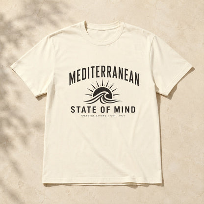 White t-shirt with 'Mediterranean State of Mind' design on a beige background