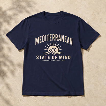 Navy blue t-shirt with 'Mediterranean State of Mind' design on a beige background