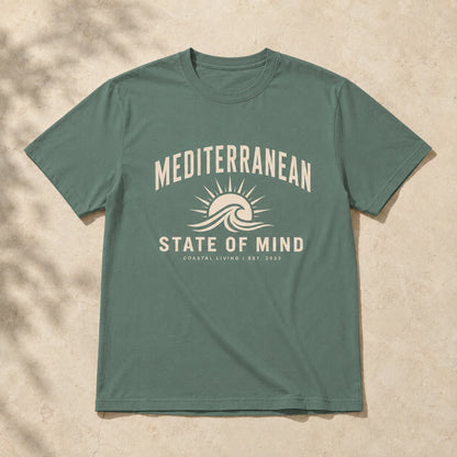 Green t-shirt with 'Mediterranean State of Mind' design on a beige background