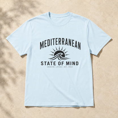 Light blue t-shirt with 'Mediterranean State of Mind' design on a beige background