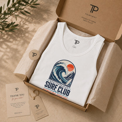 White tank top with a wave design in a branded box, surrounded by branded cards and a tag.