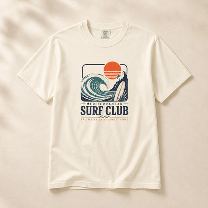 White t-shirt with 'Mediterranean Surf Club' graphic on a beige background