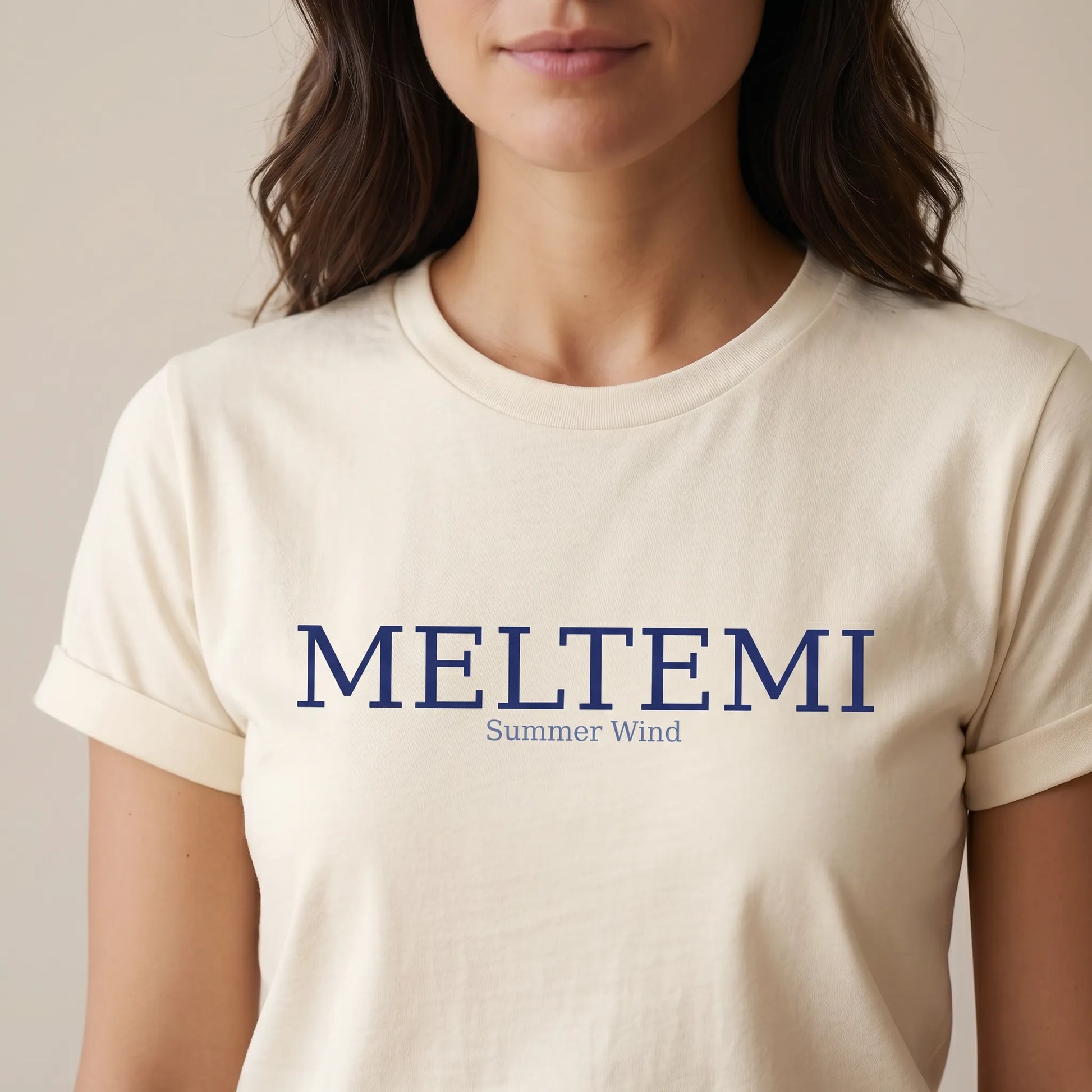 TP HERO: Person wearing a beige t-shirt with 'MELTEMI Summer Wind' text on a plain background