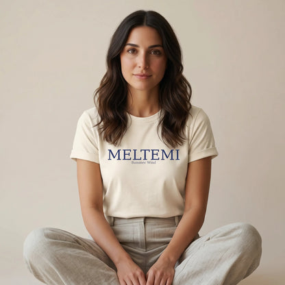 Woman wearing a white t-shirt with 'MELTEMI' logo on a beige background