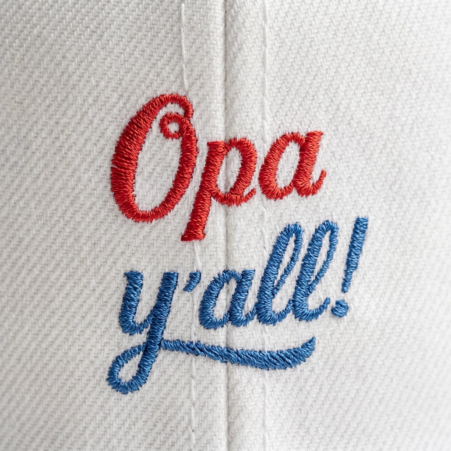 Embroidered text 'Opa y'all!' on a white background