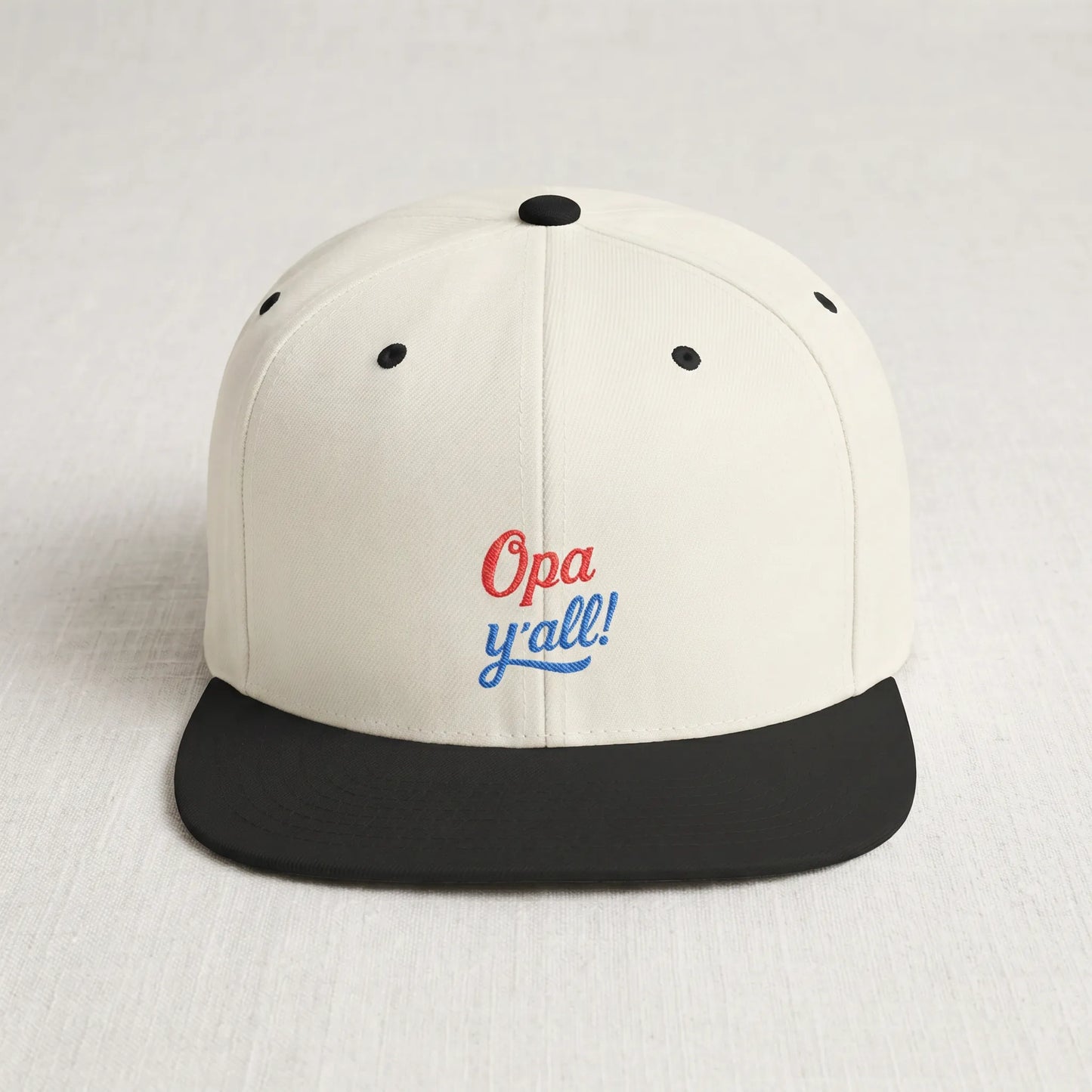 White and black cap with 'Opa y'all!' text on a light gray background
