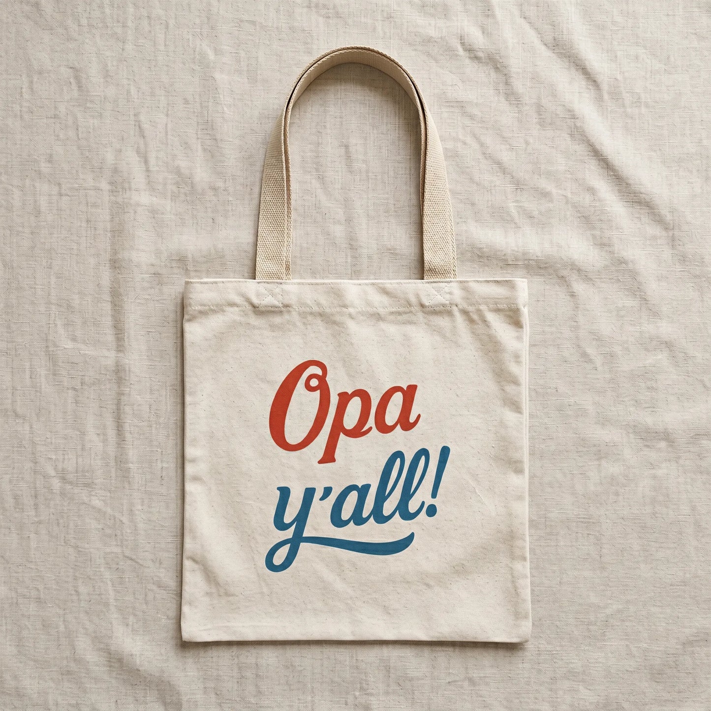 Opa y’all Greek summer tote bag with beige handles in a flat lay mockup on a light neutral background