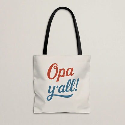 Opa y’all Greek summer tote bag with black handles in a minimal flat lay mockup