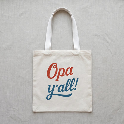 Opa y’all Greek summer tote bag with white handles in a clean flat lay product mockup