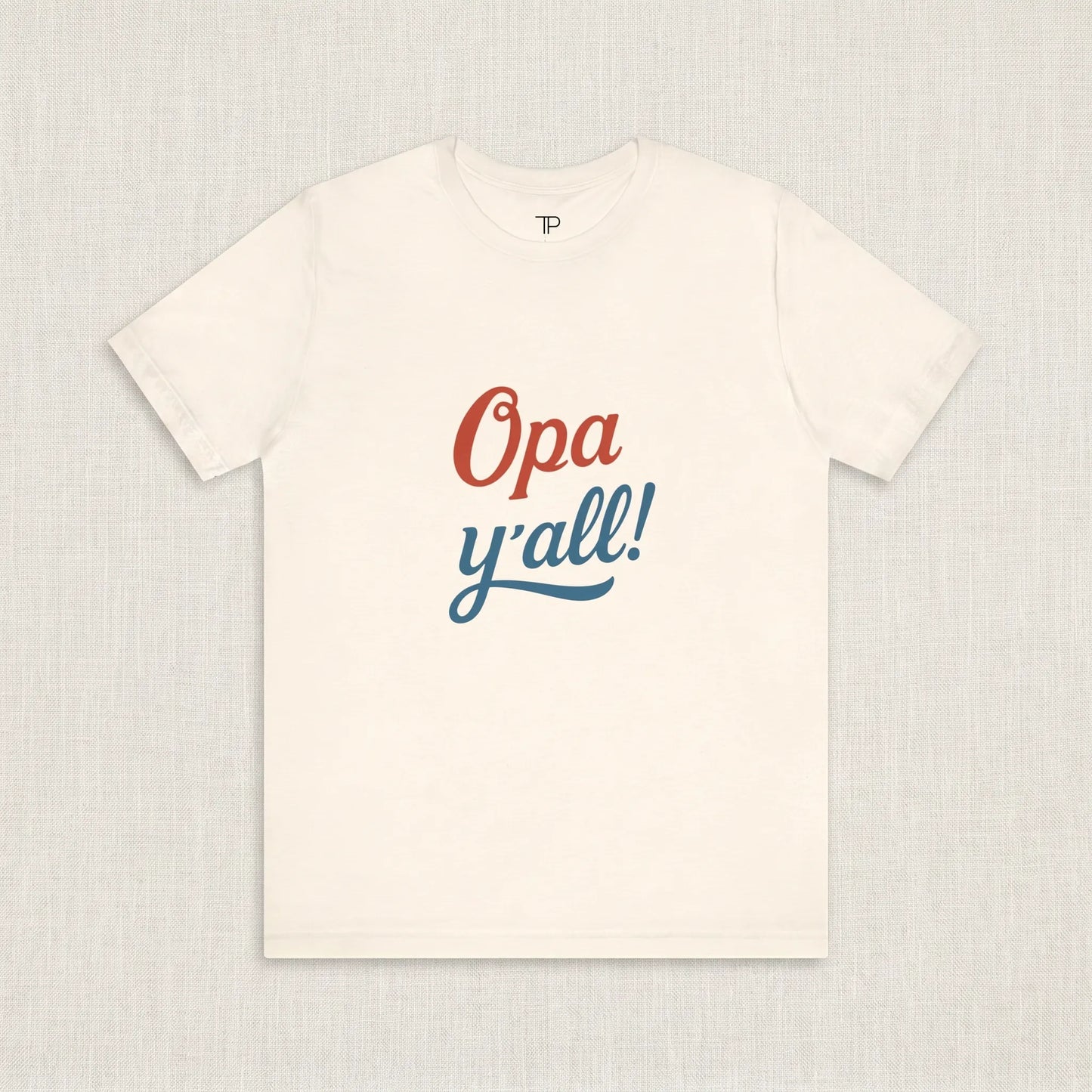 White t-shirt with 'Opa y'all!' text on a light gray background