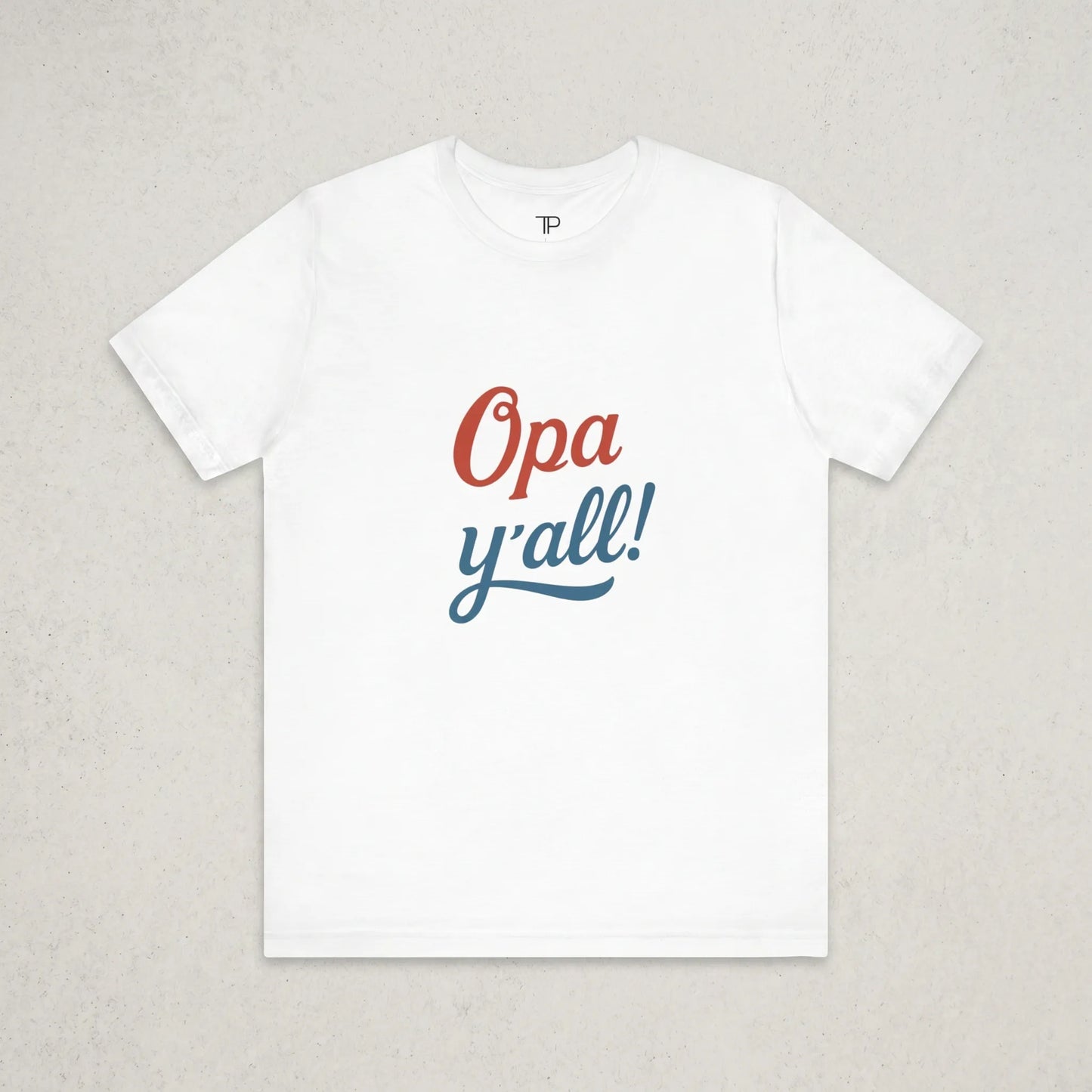 White t-shirt with 'Opa y'all!' text on a light gray background