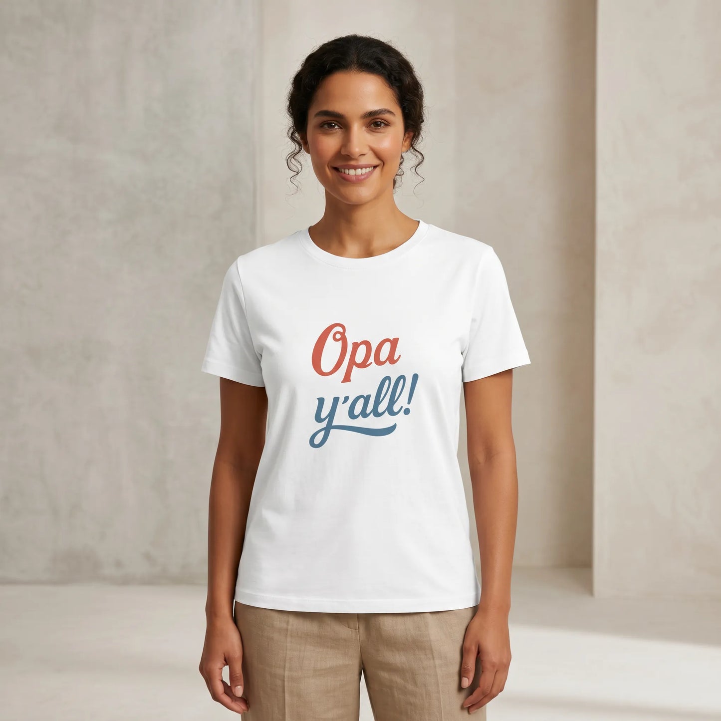 Woman wearing a white t-shirt with 'Opa y'all!' text against a plain background