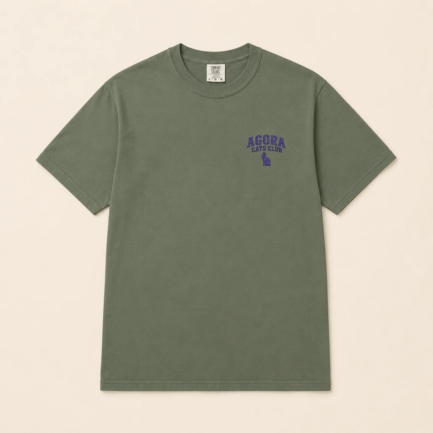 Green t-shirt with 'Agora Cafe Club' text on a beige background
