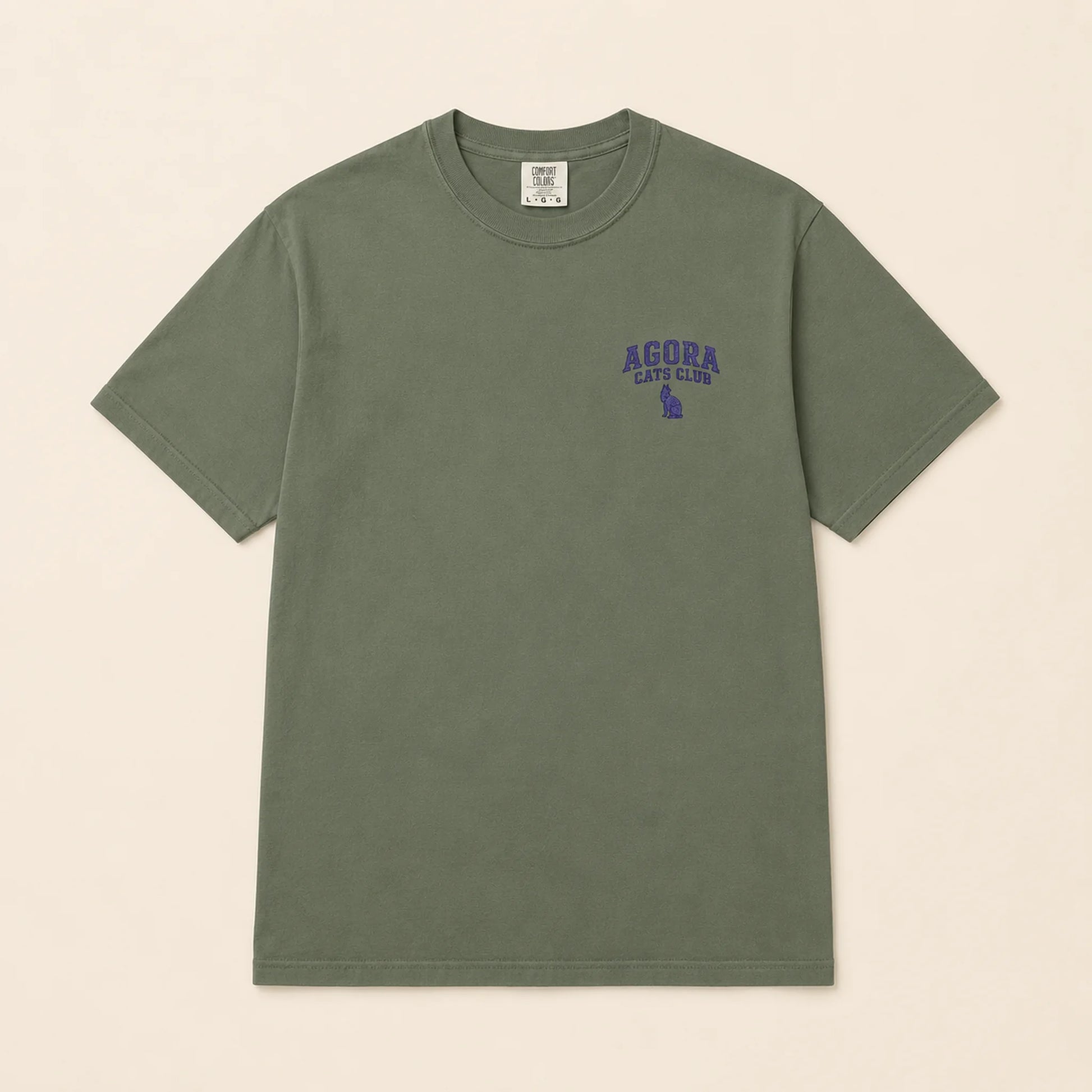 Green t-shirt with 'Agora Cafe Club' text on a beige background