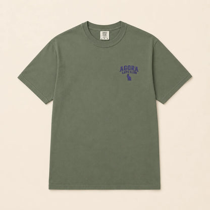 Green t-shirt with 'Agora Cafe Club' text on a beige background