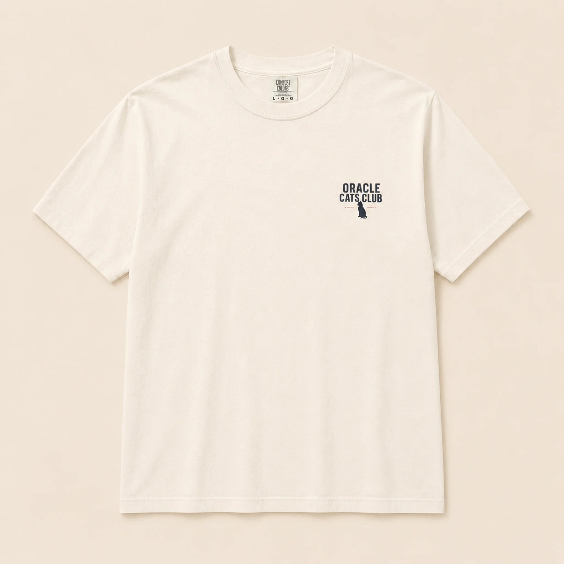 White t-shirt with 'Oracle Cats Club' logo on a beige background