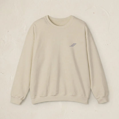 Beige sweatshirt with a small logo on a light beige background