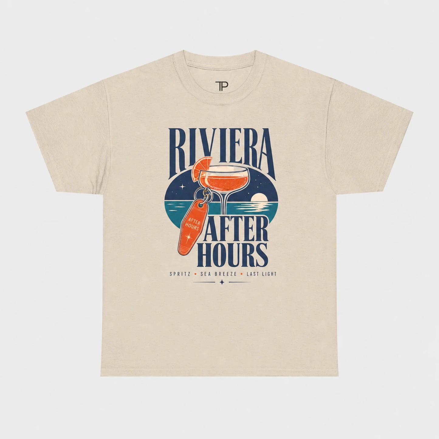 A beige short-sleeve t-shirt with a graphic print on the front featuring a cocktail glass, a key, and the text 'RIVIERA AFTER HOURS' in navy blue, with smaller text below reading 'SPATZ • DEA • NOBODY • LATE LIGHT'.